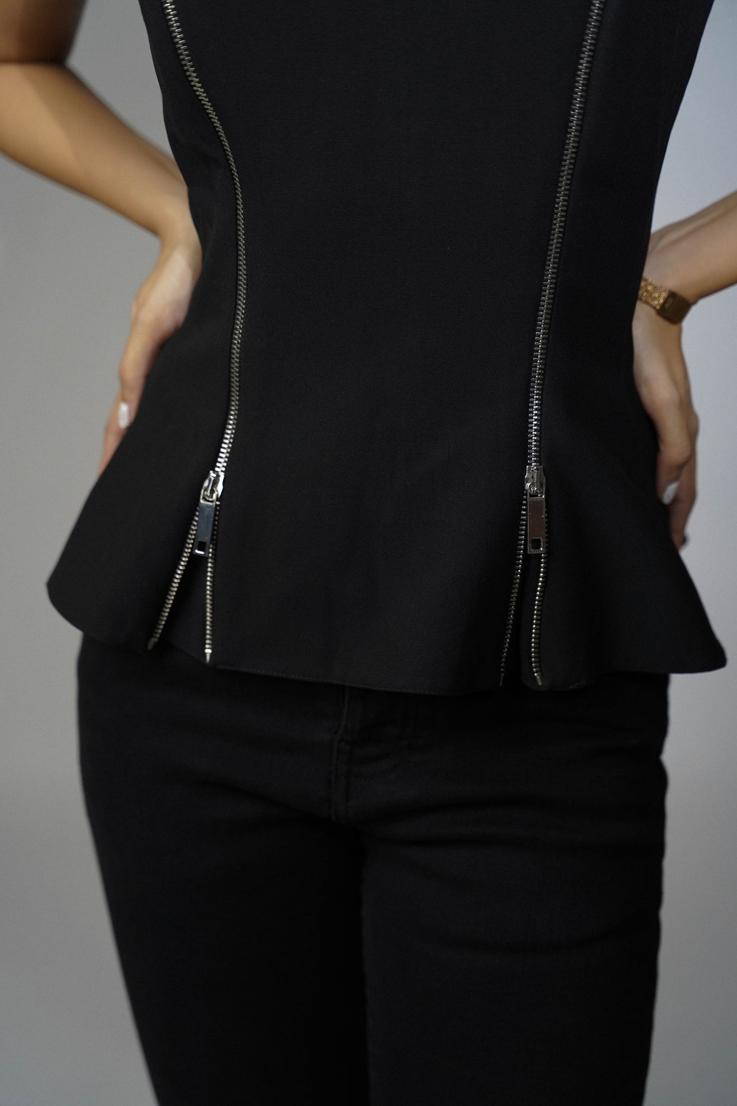 Black Peplum Top With Zipper Detailing